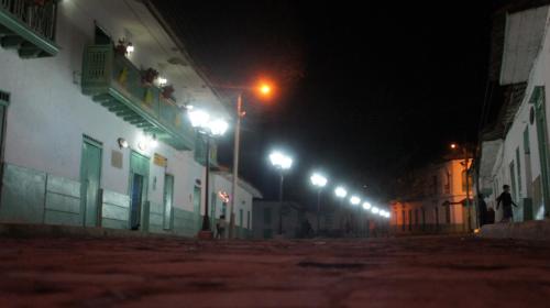 a street at night with a row of street lights at Hotel Museo la Posada del Molino in El Cocuy