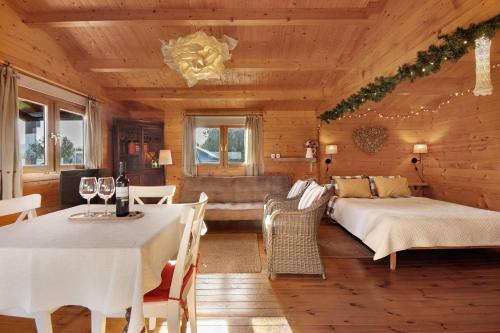 a living room with a table and a couch at Casa da Lagoa Pateira in Fermentelos