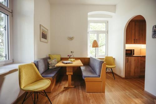 a living room with a couch and a table at Freienfeldhof Golden in Lagundo