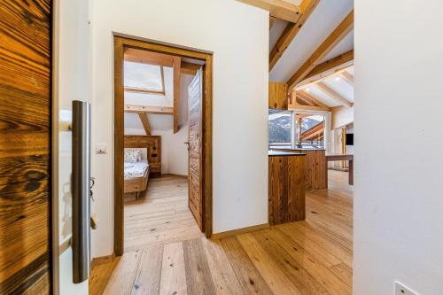 a room with a door leading to a bedroom at Naturoase Stegerhof Apt Margerite in Trodena