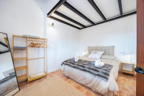 a bedroom with a bed in a room at Can Titina in Puigpunyent