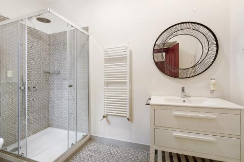 a bathroom with a shower and a sink and a mirror at Quinta do Coração de Jesus in Sintra
