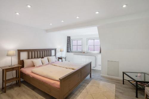 a bedroom with a large bed in a room at Ferienhaus Ludava in Hofmarksgasse