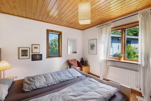 a bedroom with a bed and a window at Ferienhaus Dollrott in Süderbrarup