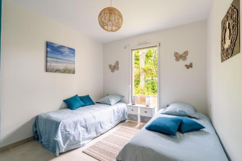 Llit o llits en una habitació de L'oasis de Jade