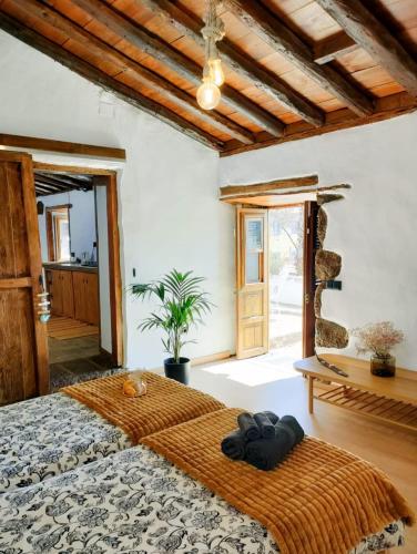 a bedroom with a large bed and a window at Casa Canaria Finca Real in Las Lagunas