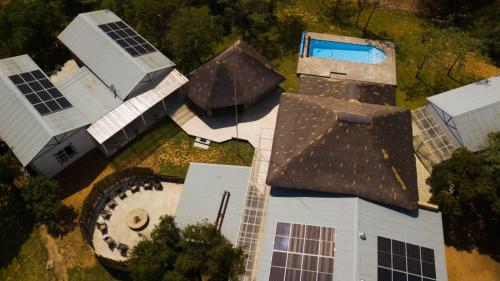 an overhead view of a house with solar panels on it at Hemel Bushveld Lodge in Vaalwater