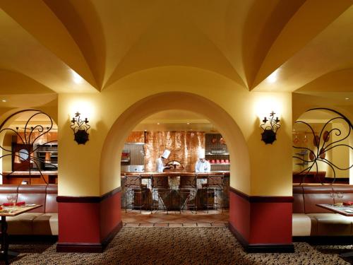 a lobby with a bar in a restaurant at Hotel Borobudur Jakarta in Jakarta