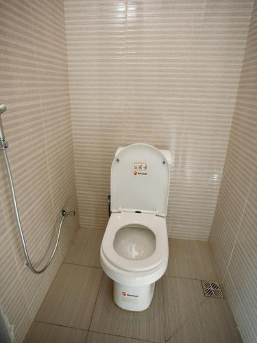 a small bathroom with a toilet in a stall at Kili Tanzania in Moshi