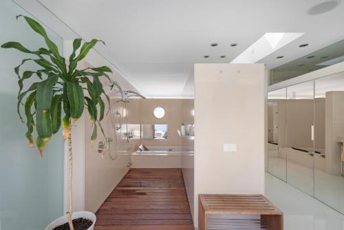 a house with a potted plant in a hallway at Casa Nirvana - Penthouse in Sitges
