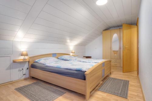 a bedroom with a bed in a small room at Mill Nordkirchen in Nordkirchen