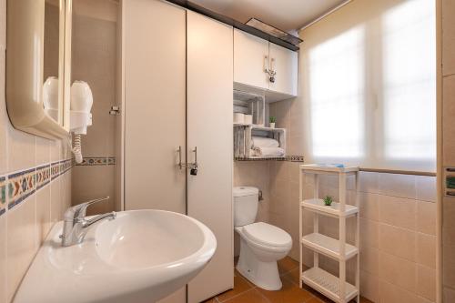 a bathroom with a sink and a toilet at Estudio bsg Sierra Nevada in Sierra Nevada