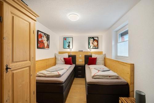 a room with two beds in the corner of a room at Ferienwohnung Morgensonne in Wolfach