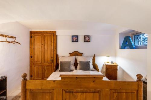 a bedroom with a wooden bed in a room at Briller Gewölbe in Wuppertal