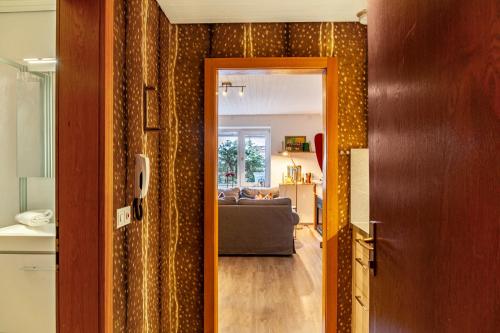 a hallway leading to a living room with a couch at Haus Excelsior Top 2 in Seefeld in Tirol