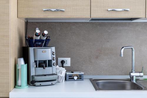 a kitchen counter with a coffee maker on it at Villa Vani - Appartamento 2 in Marina di Ragusa