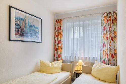 a small room with a bed and a window at Ferienwohnung Tannenblick 3-2-3-3 in Oberhof