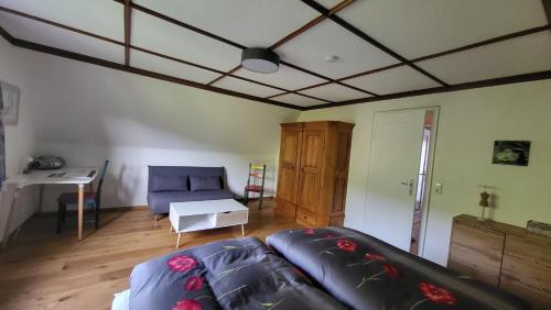 a living room with a couch and a table at Ferienhaus Barbey in St. Blasien