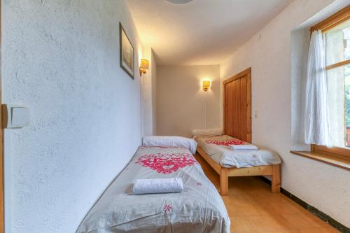 Llit o llits en una habitació de Gite Passoud 204