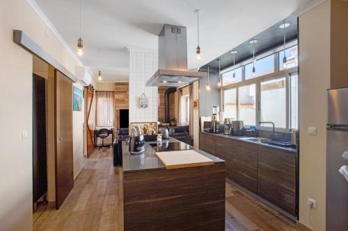 a kitchen with a sink and a counter top at Home Away From Home in Peniche