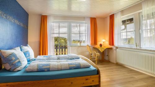 a bedroom with a bed and a window at Fewo Fuchs in Lauterbach