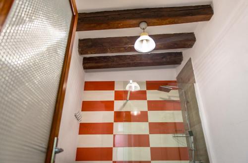 a bathroom with a checkered floor and a ceiling at Blanch 1 in Tremp
