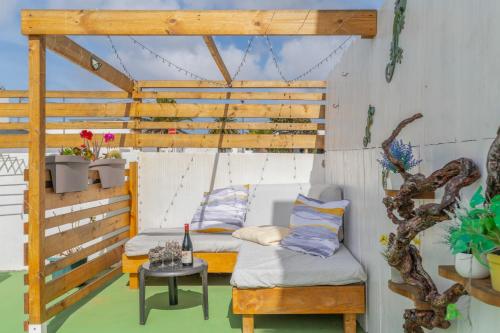 a room with two beds and a table at Apartamento Liz in Tías