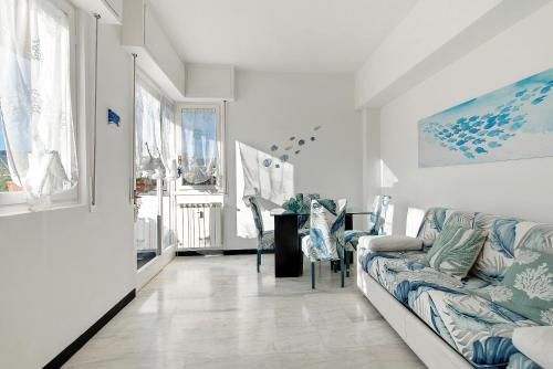 a living room with a couch and a table at Linda's Pet Friendly Beach House in Rapallo
