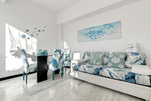 a living room with a couch and a table at Linda's Pet Friendly Beach House in Rapallo