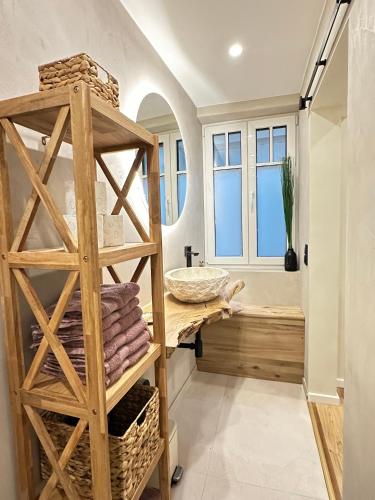 a bathroom with a wooden counter and a sink at Fewo Sand 10 - Altstadtstudio in Bamberg