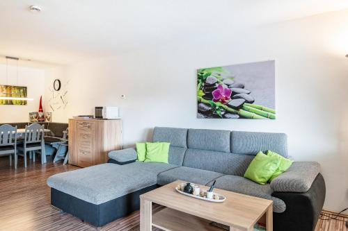 a living room with a couch and a table at Ferienwohnung Ursel in Todtmoos