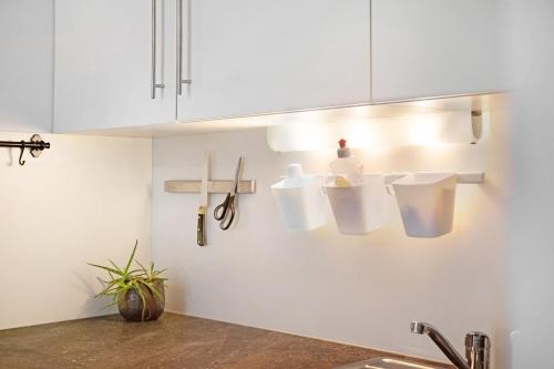 a kitchen with white cabinets and a sink at Sonnberg in Stall