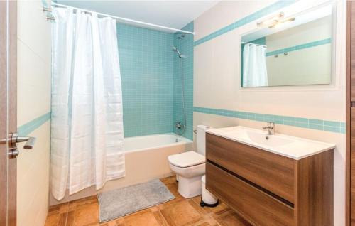 a bathroom with a sink and a toilet and a shower at Casa Olivia in Cómpeta