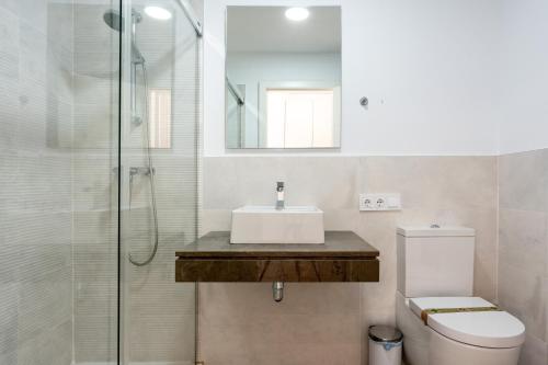 a bathroom with a sink and a toilet and a shower at 206 Navigolf 3 in La Cala de Mijas