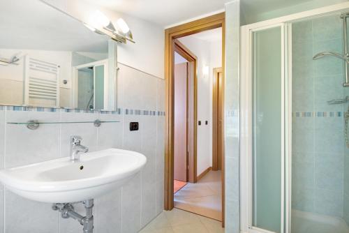a bathroom with a sink and a shower at Villa Ciò in Bonassola