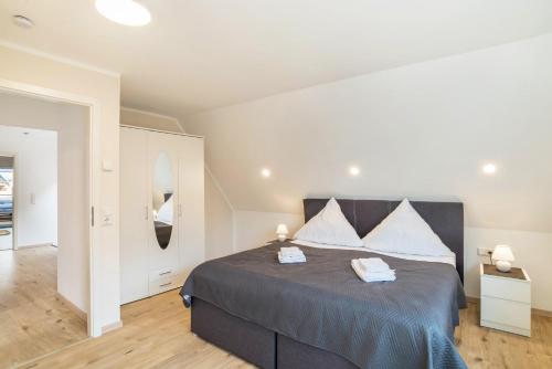 a bedroom with a large bed in a room at Unique Apartments Wiesloch in Wiesloch