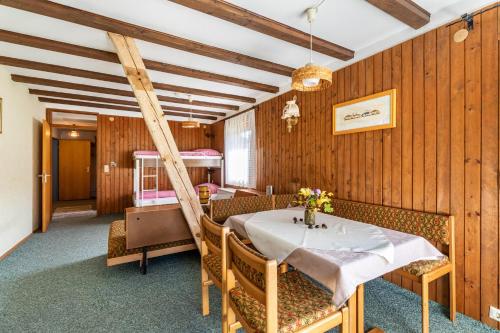 a dining room with a table and chairs at Ferienwohnung an der Lauter in Indelhausen