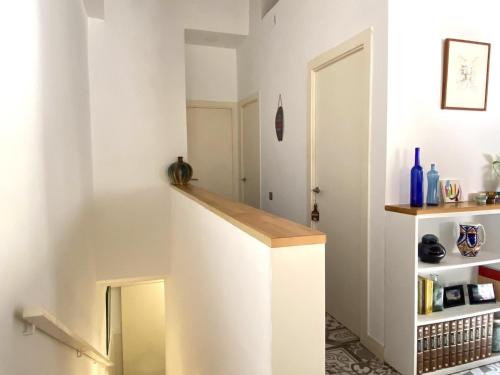 a staircase in a home with white walls at Reconnectar Malgrat de Mar Emili in Malgrat de Mar