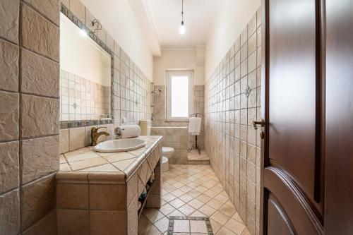 a bathroom with a sink and a toilet at Villa Filippa in Nicosia
