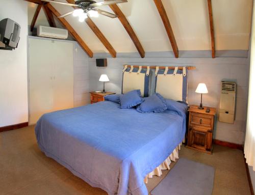 Giường trong phòng chung tại Cabañas y Lofts El Portal