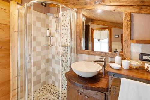 a bathroom with a sink and a shower at Chalet Del Cuore in Valdisotto