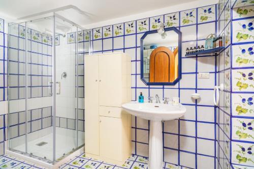 a bathroom with a sink and a shower at Casa Florio in Taormina