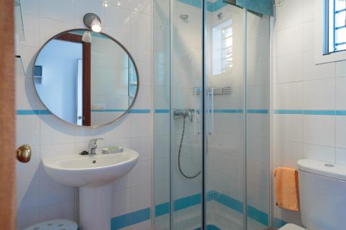 a bathroom with a sink and a shower at El Balcón de la Sierra in Seville