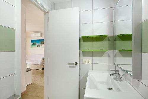 a bathroom with a sink and a mirror at Casa Puerto Rico in Mogán