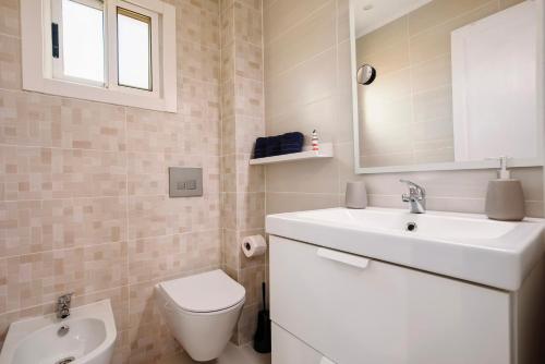 a bathroom with a sink and a toilet at Casa Relax in Costa Calma