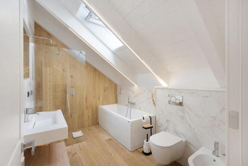 a white bathroom with a sink and a toilet at Principe Di Agerola in Agerola