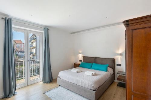 a bedroom with a bed and a large window at Principe Di Agerola in Agerola