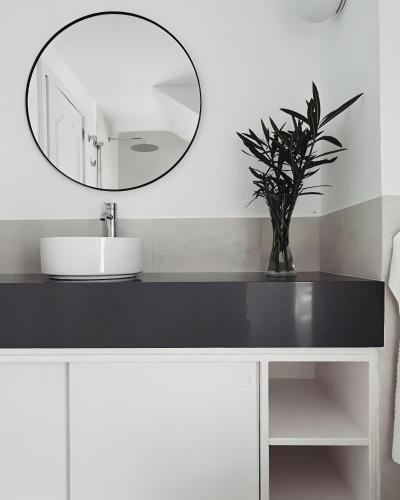 a bathroom with a sink and a mirror at Villa Tabaiba in Haría
