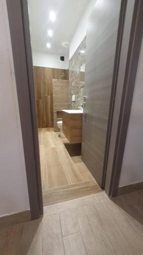 a bathroom with a shower and a sink and a toilet at Villa Assunta in Lecce