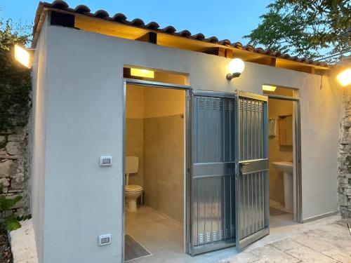 an open door to a bathroom with a toilet at Torre Cappavecchia in Molfetta